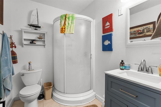 full bath featuring toilet, tile patterned floors, a shower stall, and vanity