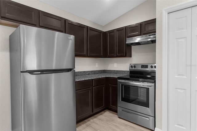 kitchen featuring dark brown cabinetry, light wood finished floors, lofted ceiling, stainless steel appliances, and under cabinet range hood