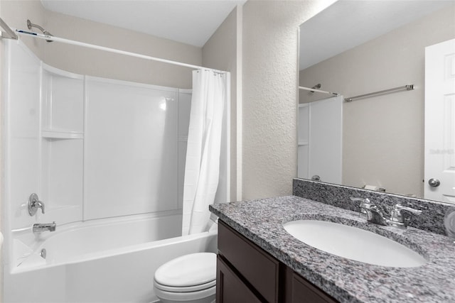 full bathroom featuring toilet, a textured wall, shower / tub combo with curtain, and vanity