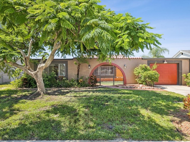 3730 Sail Dr, New Port Richey, FL 34652 - view of front of house with stucco siding, an attached garage, and driveway