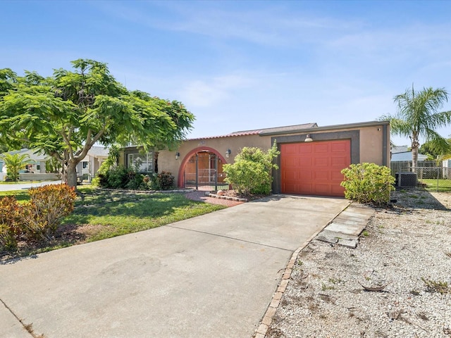 3730 Sail Dr, New Port Richey, FL 34652 - view of front of home with stucco siding, concrete driveway, and a garage