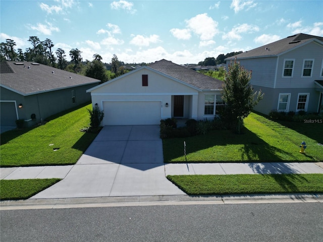 view of front of house featuring a garage, concrete driveway, a front lawn, and stucco siding