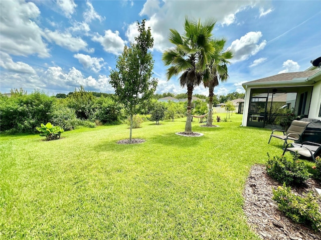 view of yard featuring a sunroom