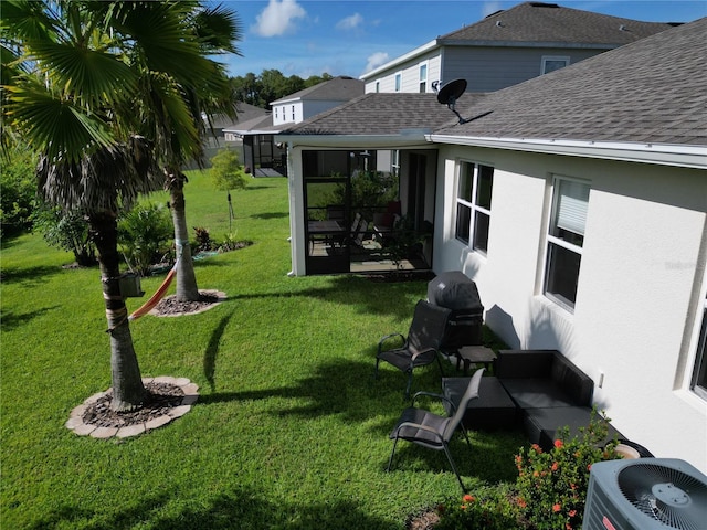 view of yard with a sunroom and cooling unit