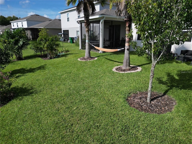 view of yard featuring a sunroom