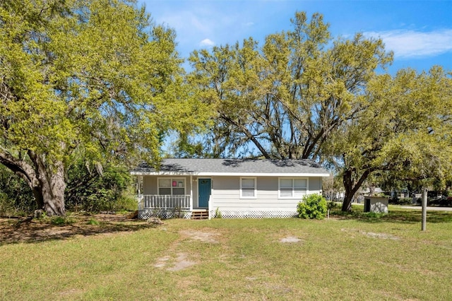 view of front of home featuring a porch and a front yard