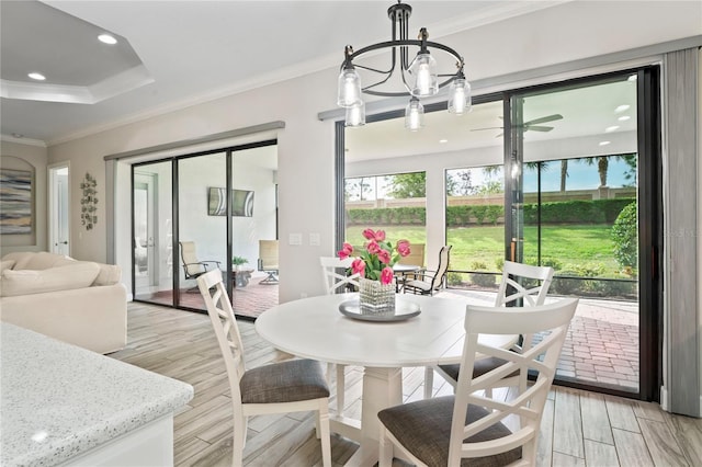 3130 Forsythia Dr, Odessa, FL 33556 - dining area with crown molding, light wood finished floors, recessed lighting, and a chandelier