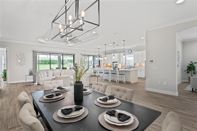 3130 Forsythia Dr, Odessa, FL 33556 - dining area featuring recessed lighting, ornamental molding, baseboards, light wood finished floors, and a chandelier