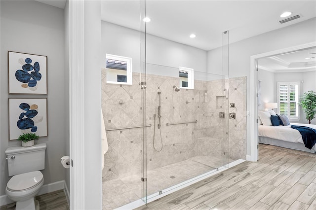 3130 Forsythia Dr, Odessa, FL 33556 - full bathroom with a shower stall, toilet, ensuite bath, baseboards, and wood finished floors