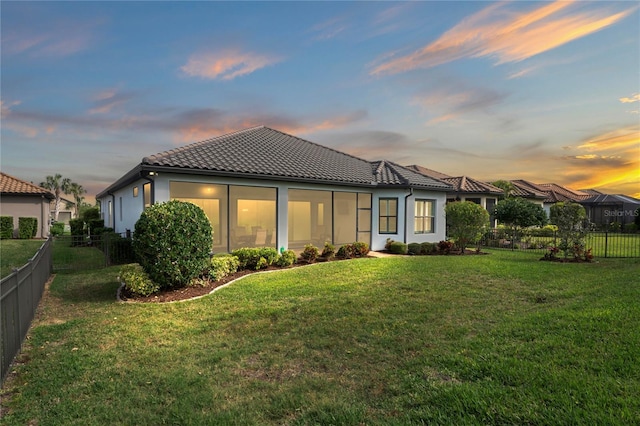 3130 Forsythia Dr, Odessa, FL 33556 - back of property at dusk featuring a tile roof and stucco siding
