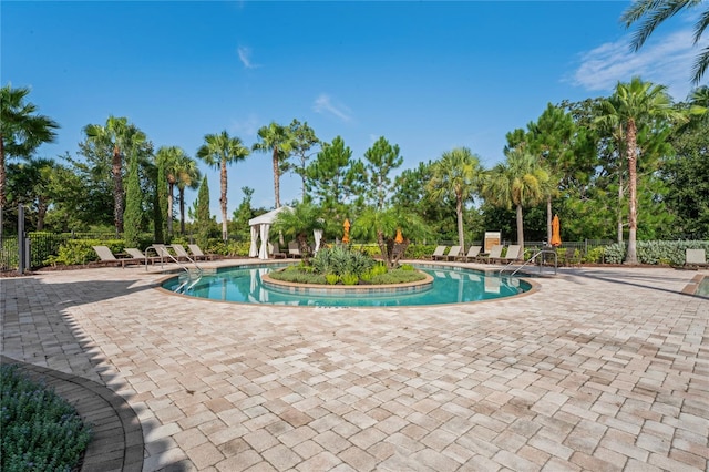 3130 Forsythia Dr, Odessa, FL 33556 - community pool featuring a patio, a gazebo, and view of wooded area