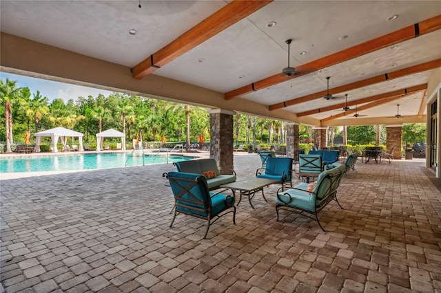3130 Forsythia Dr, Odessa, FL 33556 - view of patio / terrace featuring a gazebo, a ceiling fan, an outdoor pool, view of scattered trees, and outdoor lounge area