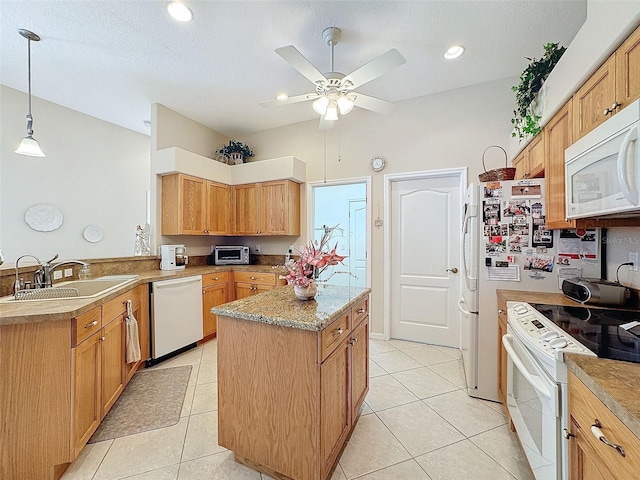 kitchen featuring light tile patterned flooring, a kitchen island, a sink, white appliances, and a peninsula