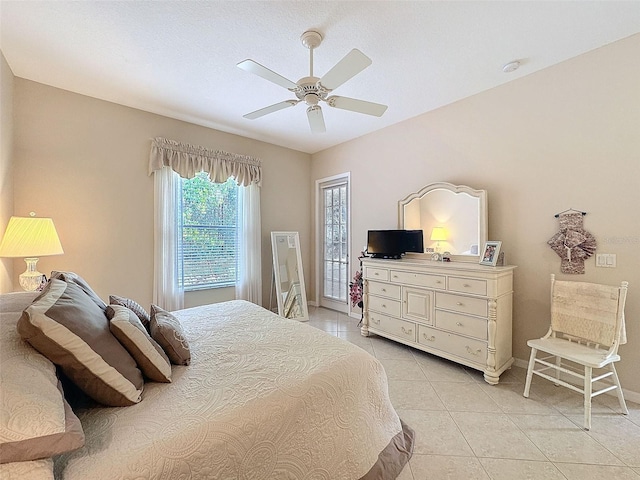 bedroom featuring ceiling fan, baseboards, and light tile patterned flooring