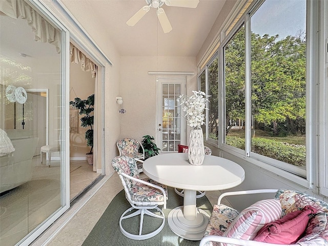 sunroom / solarium with plenty of natural light and a ceiling fan