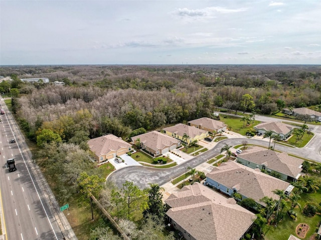 aerial view with a forest view and a residential view