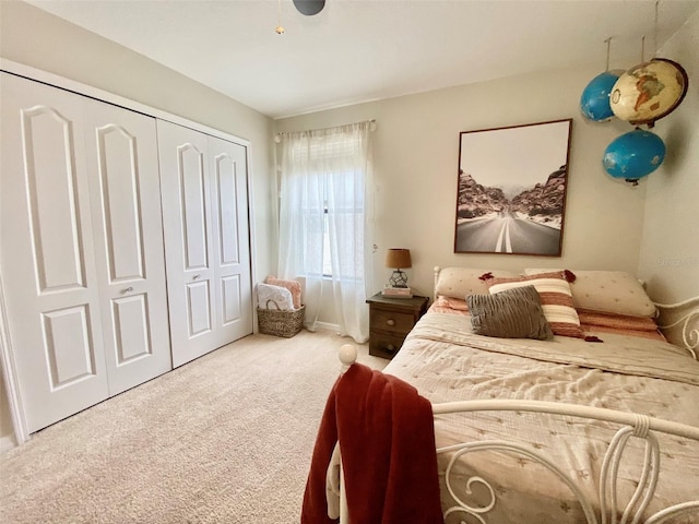 carpeted bedroom featuring a closet