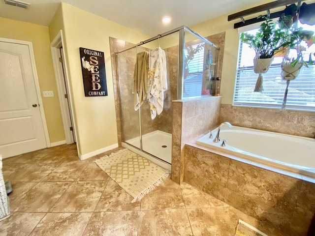 full bath featuring baseboards, a stall shower, a garden tub, and tile patterned floors