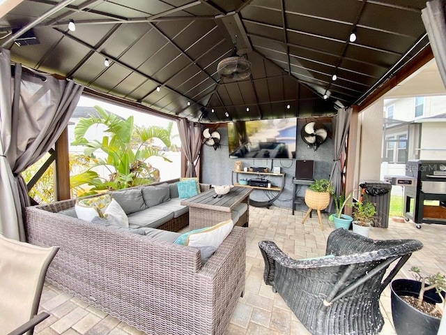 view of patio featuring outdoor lounge area and a gazebo