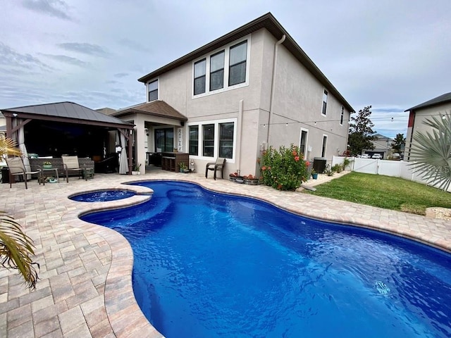 view of swimming pool with a fenced in pool, a patio, a gazebo, an in ground hot tub, and a fenced backyard