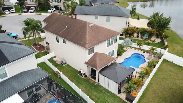 drone / aerial view with a residential view and a water view