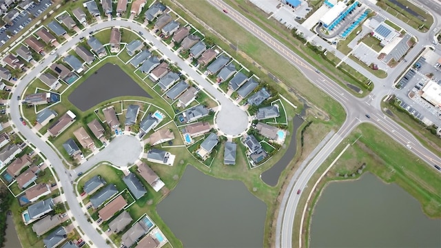 aerial view with a water view and a residential view