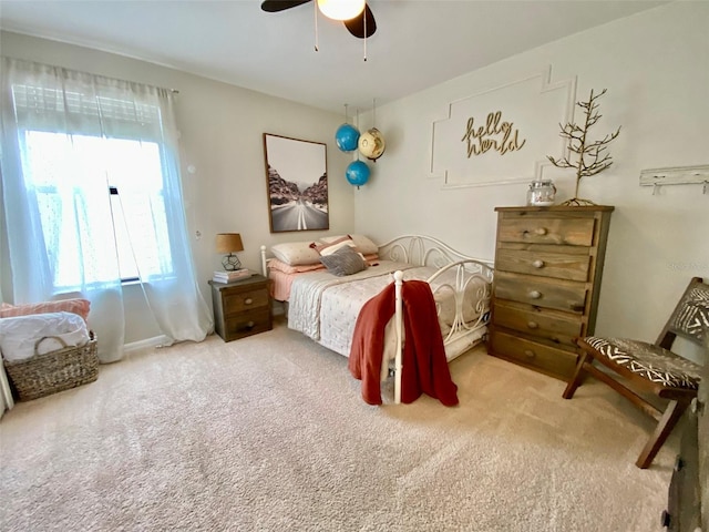 bedroom featuring ceiling fan and carpet flooring