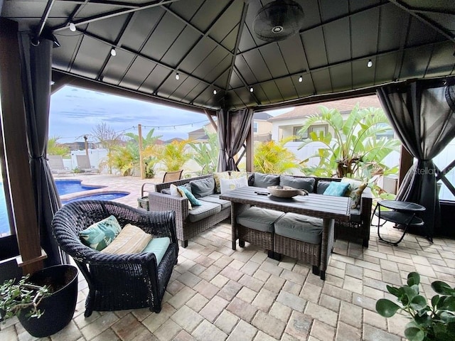 view of patio / terrace with a gazebo, outdoor lounge area, and a fenced in pool