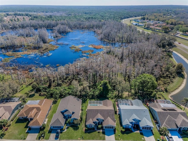 bird's eye view with a residential view, a water view, and a forest view