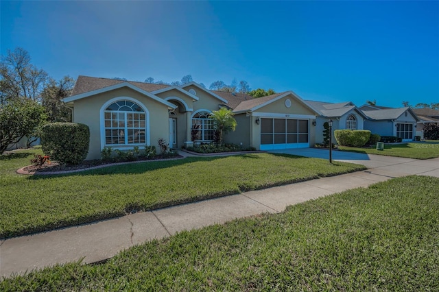 ranch-style house with an attached garage, driveway, a front lawn, and stucco siding