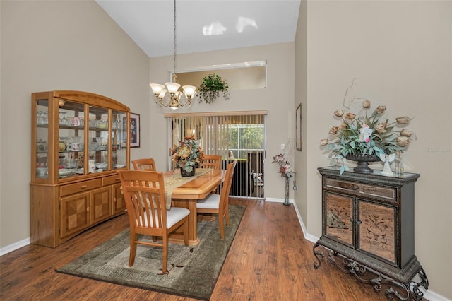 dining area featuring high vaulted ceiling, baseboards, dark wood finished floors, and a notable chandelier