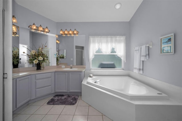 full bath with double vanity, a stall shower, a garden tub, tile patterned flooring, and a sink