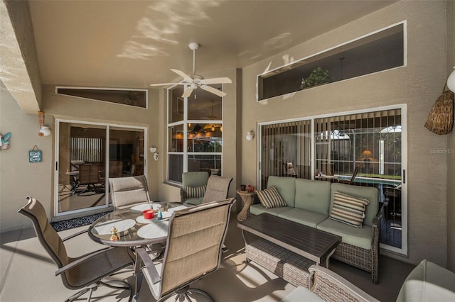 view of patio featuring outdoor dining area, ceiling fan, and outdoor lounge area