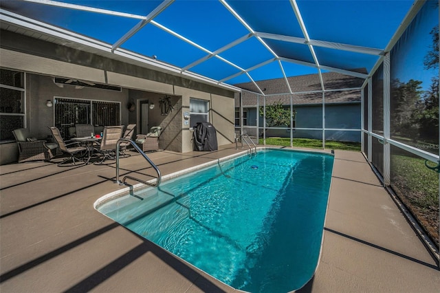 outdoor pool featuring a lanai, outdoor dining space, and a patio