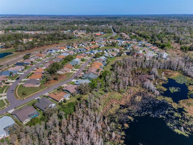 bird's eye view featuring a water view and a residential view