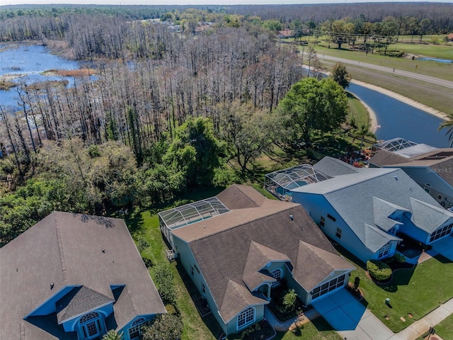 aerial view featuring a water view and a wooded view