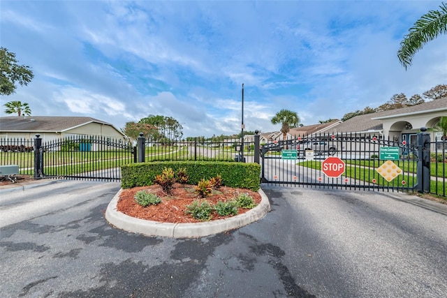 view of gate featuring fence