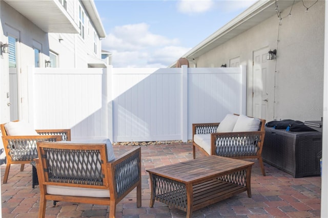 view of patio / terrace featuring a fenced backyard and an outdoor living space