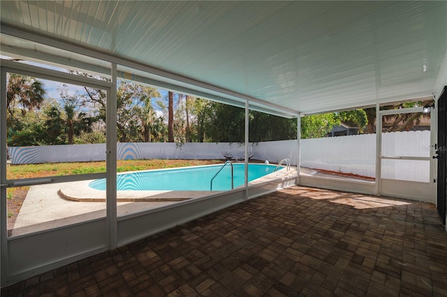 view of pool featuring a patio area, a fenced backyard, and a fenced in pool