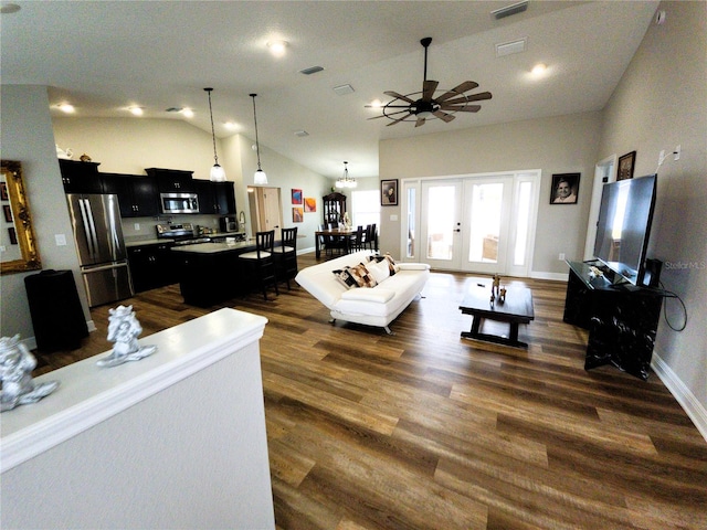 living room featuring visible vents, dark wood finished floors, baseboards, ceiling fan, and high vaulted ceiling