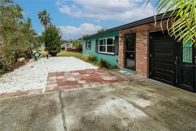 view of patio / terrace with concrete driveway