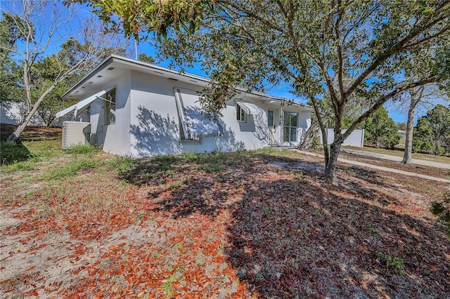 view of home's exterior with stucco siding