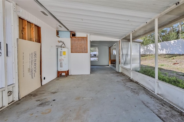 unfurnished sunroom featuring electric water heater