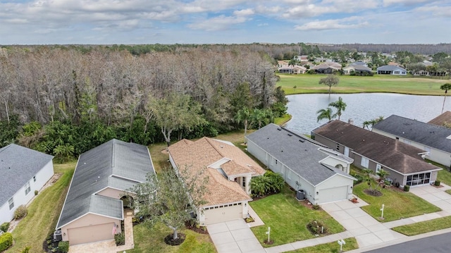 birds eye view of property featuring a residential view and a water view