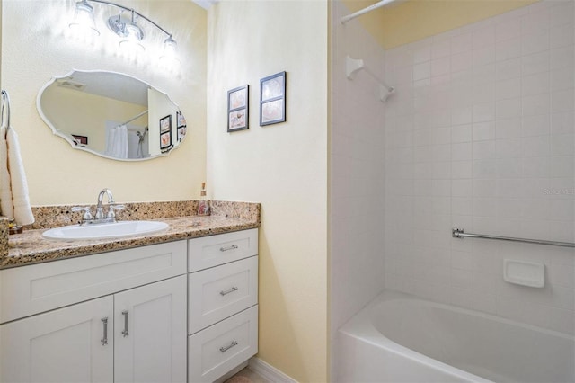 full bathroom featuring shower / tub combo, vanity, and baseboards