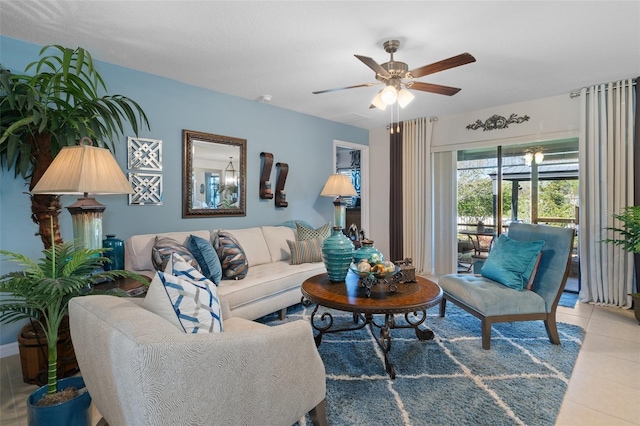 living room featuring ceiling fan and light tile patterned flooring