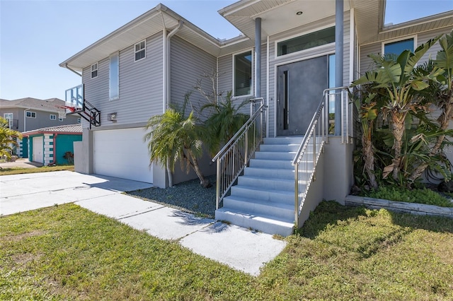 view of front of home with a garage and driveway