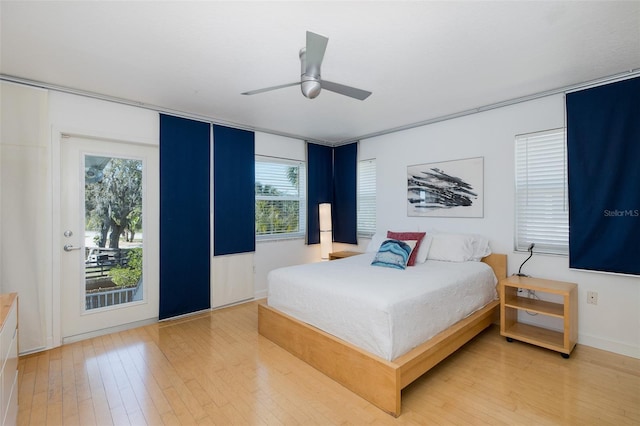 bedroom with light wood finished floors and ceiling fan