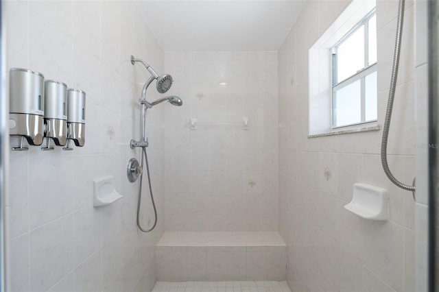 bathroom with a tile shower