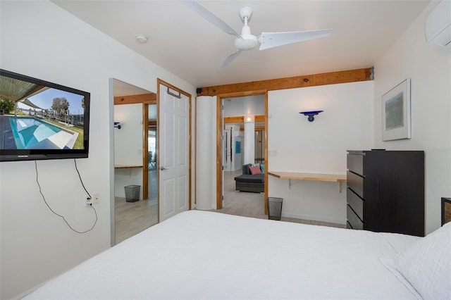 bedroom featuring a ceiling fan, a wall mounted air conditioner, and wood finished floors